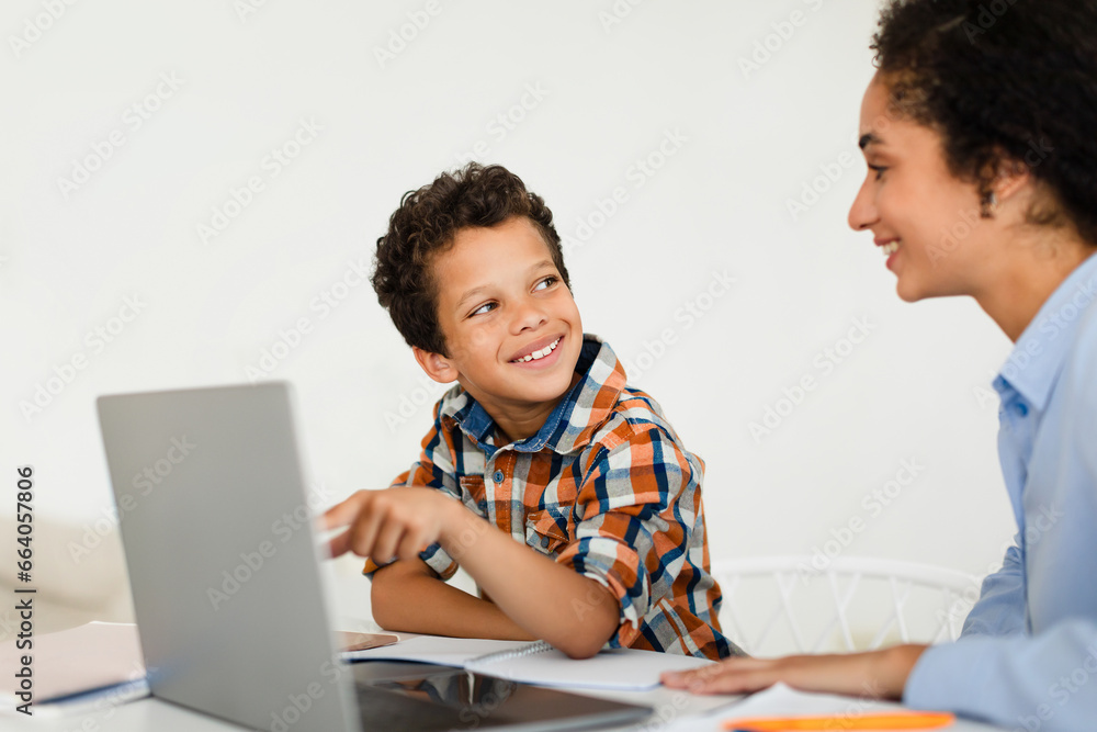 Happy Lady Teaching Little Son Using Laptop At Home Happy Lady Teaching Little Son Using Laptop At Home