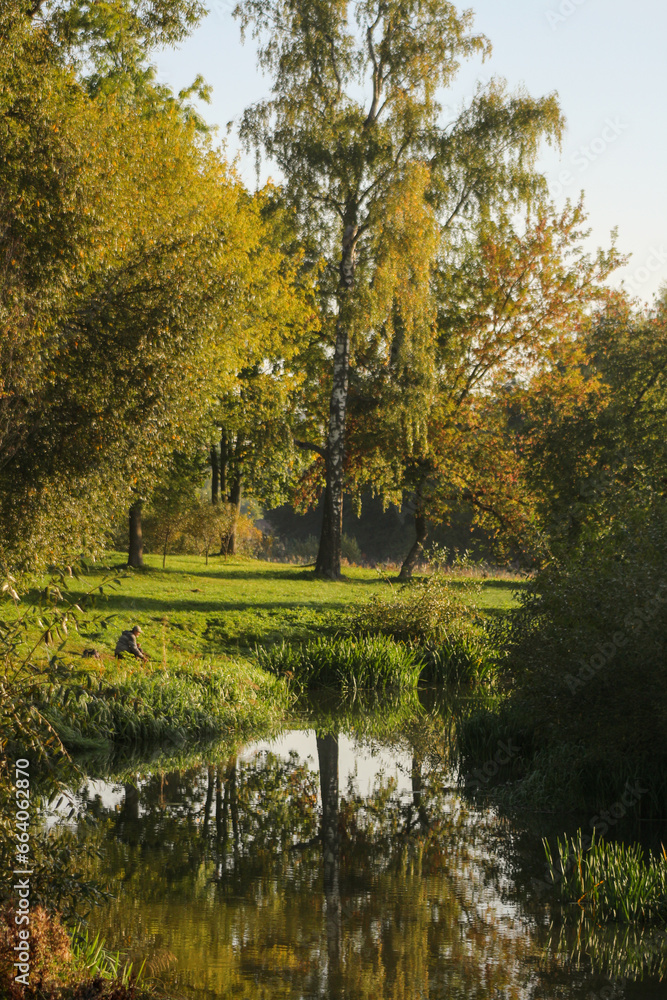 Fisherman on the river in autumn