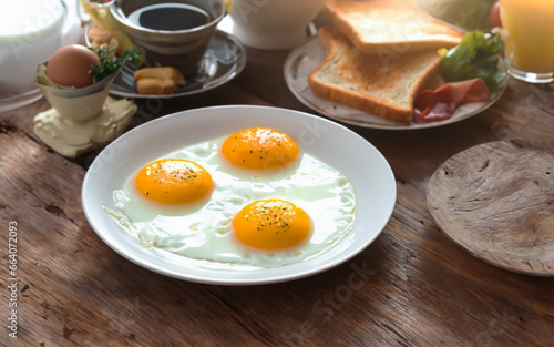 Breakfast with eggs and toast.English breakfast with tea.