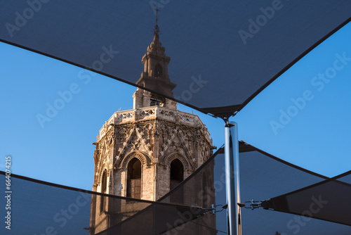 Detail of the Miguelete: the bell tower of the Valencia Cathedral which has a Valencian Gothic style. Reina Square in Valencia at daylight, Editorial Photography. photo