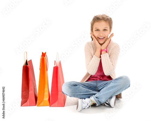Little girl with shopping b...