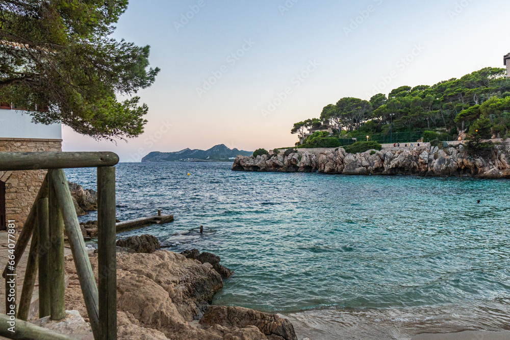 the beautiful cala gat bay and beach with turquoise water of the Mediterranean Sea and cliffs of Cala Ratjada on Majorca Island, Spain