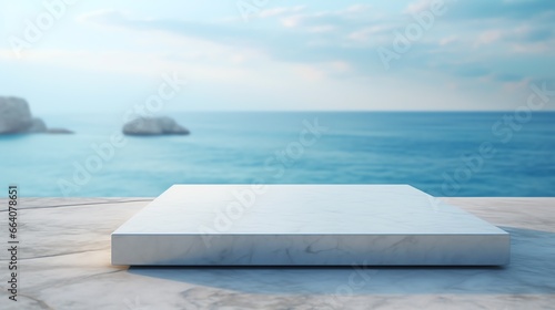 a white square object on a stone surface with a body of water in the background