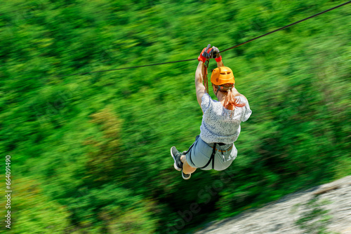 Tableau sur toile Women Enjoying a Thrilling Zipline Experience, Embracing the Exhilaration of Act