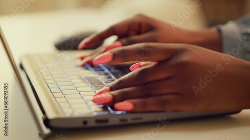 Freelancer typing new story details on online blog, self employed woman at home office. African american person working on freelancing and blogging, writing modern articles. Handheld shot. Close up.