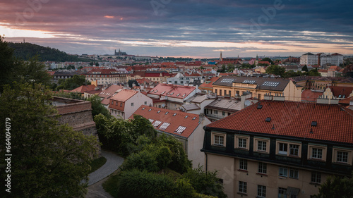 View of Prague Castle from the summer Vyšehrad at sunset. Amazing view of the city rooftops.