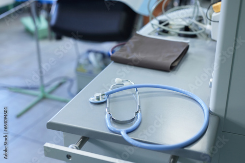 stethoscope on the table against the background of the hospital room, selective focus