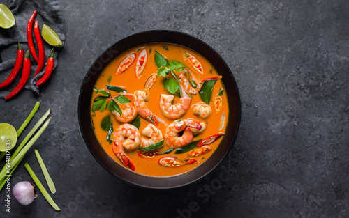 A Soup with shrimps. View from the above on gray background