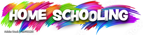 Home schooling paper word sign with colorful spectrum paint brush strokes over white.