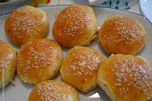 Homemade buns made of wheat flour and eggs with sesame.