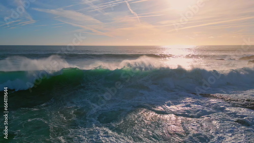 Powerful ocean surf rolling seashore sunny morning. Huge sea waves making foam