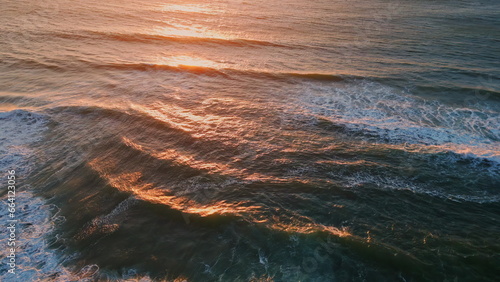 Sunset ocean reflecting sun closeup. Marine sunrise in calm morning sea surface