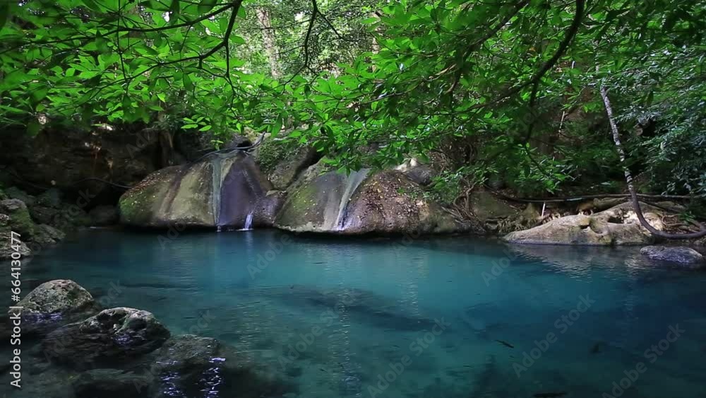Erawan waterfall beautiful emerald lake and rocks in wild jungle forest in Erawan National park, Kanchanaburi, Thailand Erawan waterfall beautiful emerald lake and rocks in wild jungle forest in Erawan National park, Kanchanaburi, Thailand