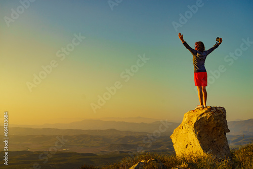 Woman enjoy landscape with arms up