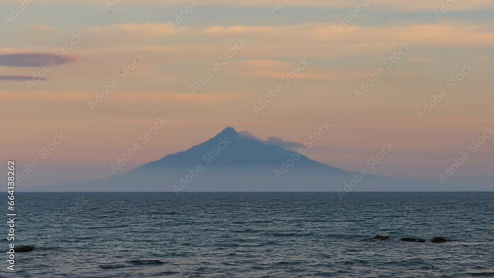 Sunset time lapse of clouds moving on volcanic Mt. Rishiri on Hokkaido island Sunset time lapse of clouds moving on volcanic Mt. Rishiri on Hokkaido island