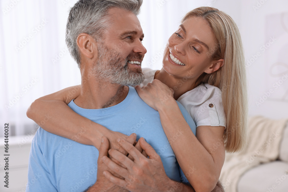 Portrait of happy affectionate couple at home. Romantic date