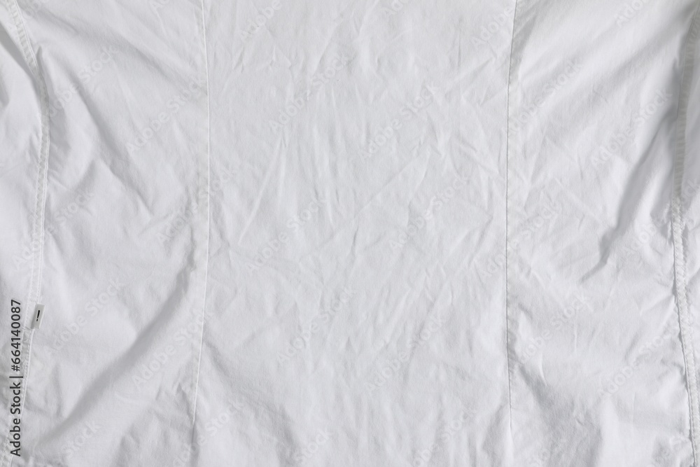 Crumpled white fabric as background, top view Crumpled white fabric as background, top view