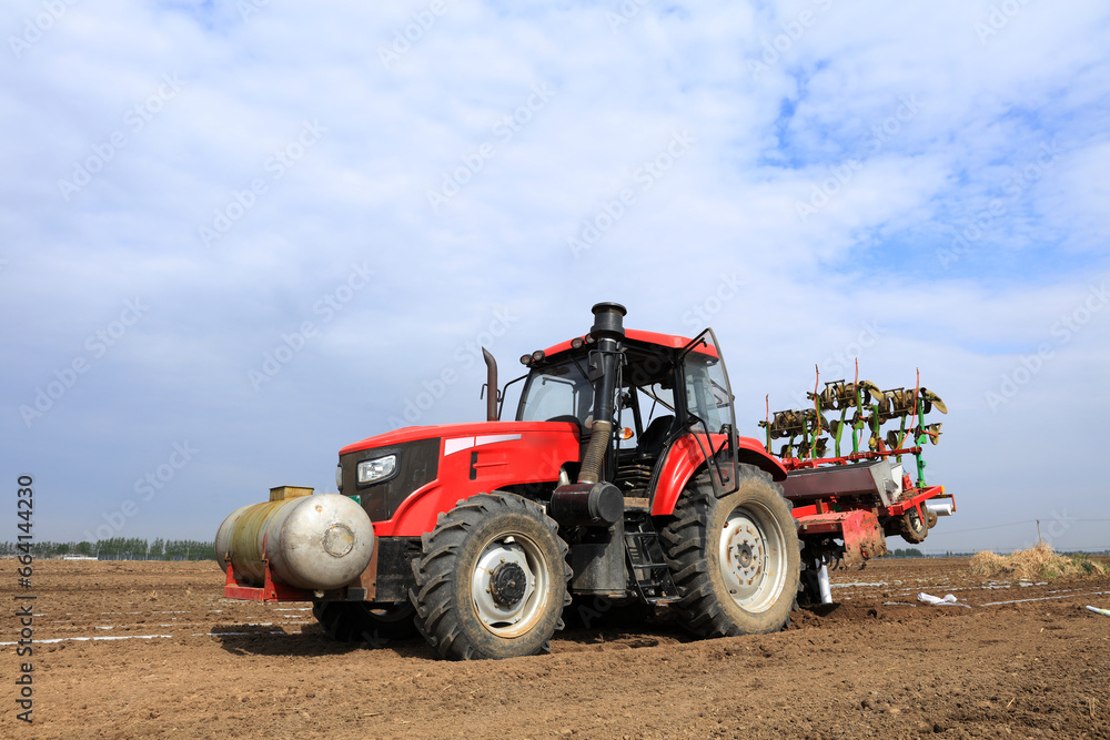 In spring, farmers use farm machinery to grow peanuts In spring, farmers use farm machinery to grow peanuts