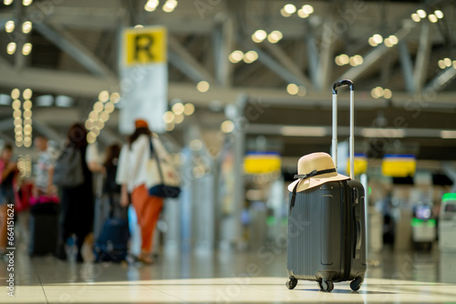 The suitcases in an empty airport hall, traveler cases in the departure airport terminal waiting for the area, vacation concept, blank space for text message or design