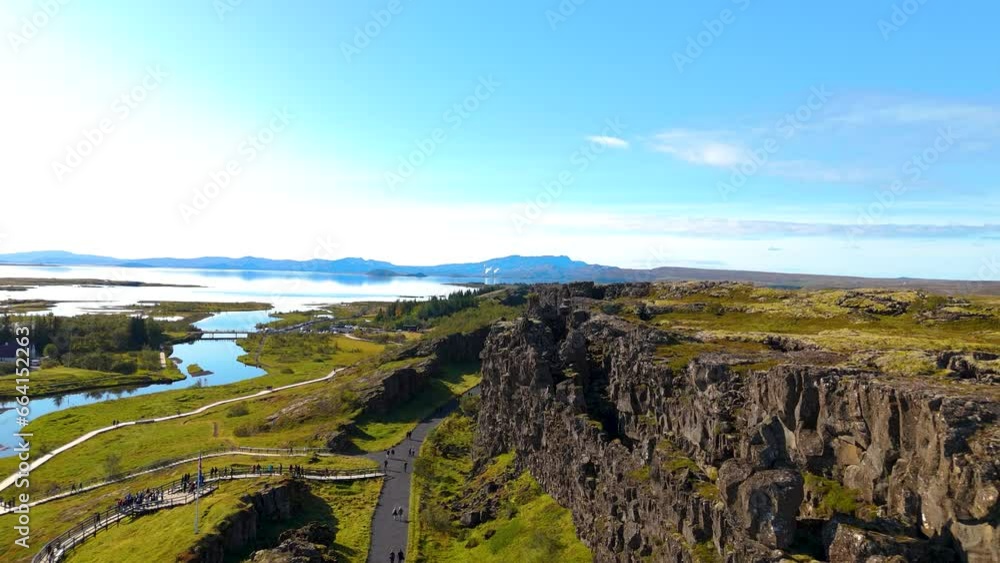 Aerial view of Thingvellir National Park, above the tectonic plates. Blue skies and greenery, Lake Bingvallavatn in the background Aerial view of Thingvellir National Park, above the tectonic plates. Blue skies and greenery, Lake Bingvallavatn in the background