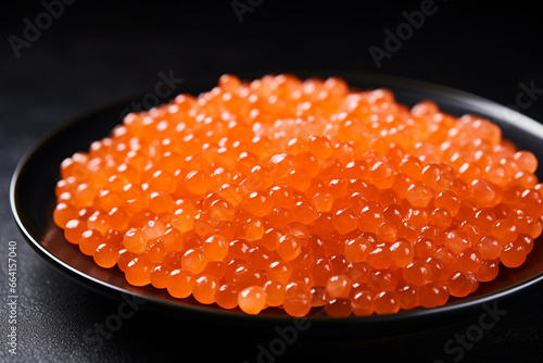Salmon Red Caviar in a white plate on a dark background, generative ai