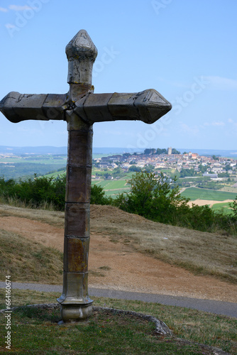 View on cross and Sancerre, medieval hilltop town in Cher department, France overlooking  Loire valley with Sancerre Chavignol appellation vineyards, noted for its white dry wine. photo