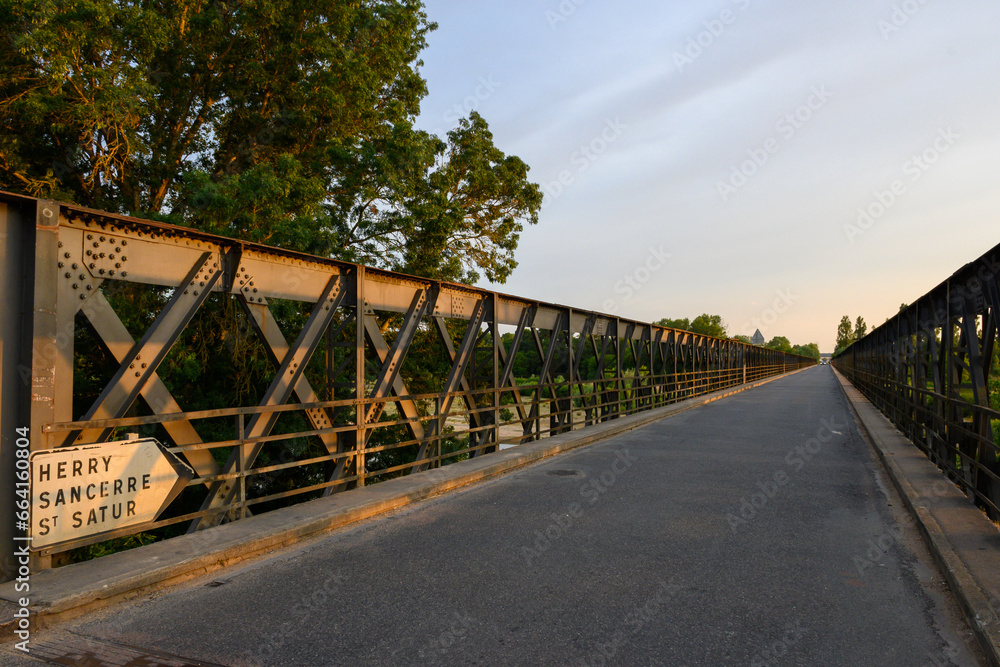 View on Pont de Pouilly-sur-Loire bridge 496 km from the source and 496 km from the mouth of the Loire river near Pouilly-sur-loire, Central France ar sunset