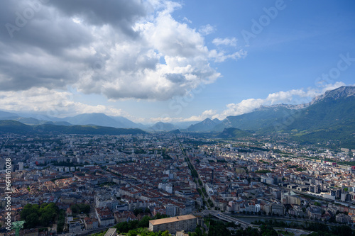 View on central part of Grenoble city from Bastille fortres witn mountains around, old cable car, Isere, France