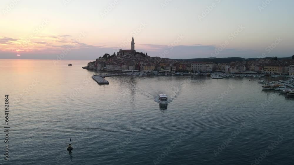 A drone shot of the small harbor of Rovinj, Croatia during sunset A drone shot of the small harbor of Rovinj, Croatia during sunset