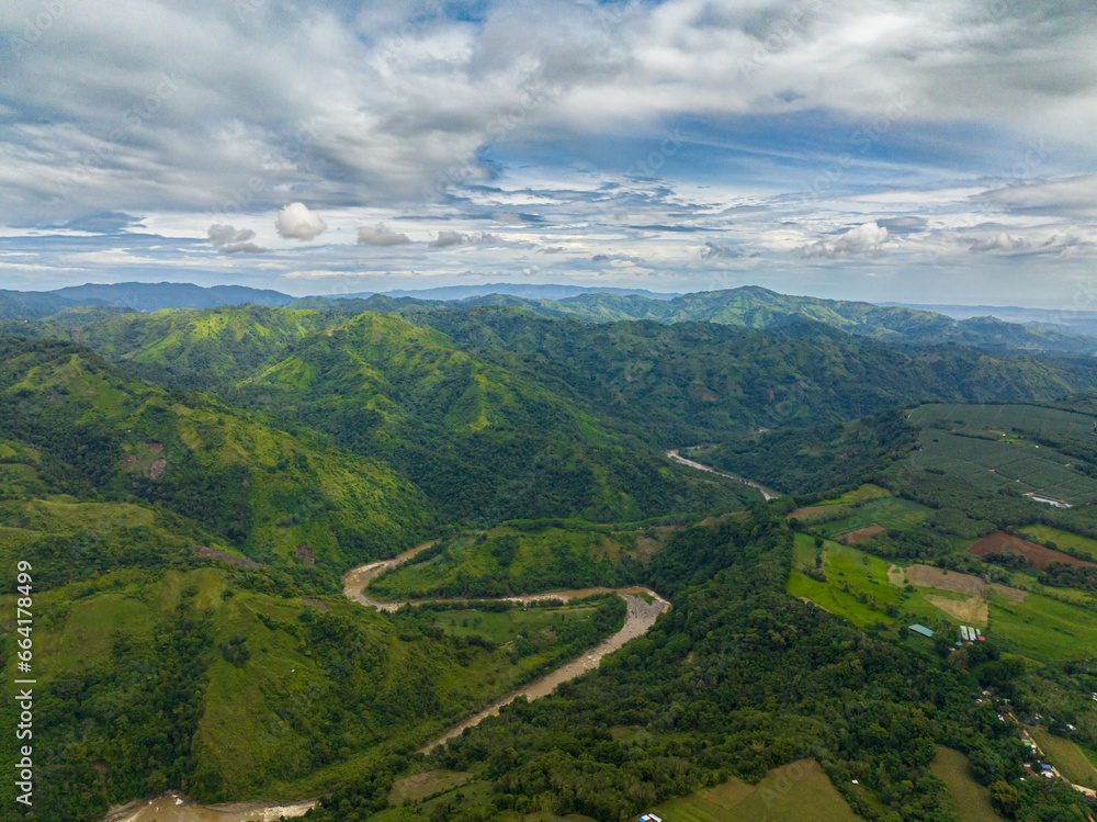Aerial view of mountain with canyon surrounded by green forest in Mindanao. Philippines.