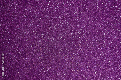 Fondo de brillos / textura glitter de color fucsia/rosa/violeta/morado. Se puede usar como fondo de año nuevo o navidad/ fiesta.