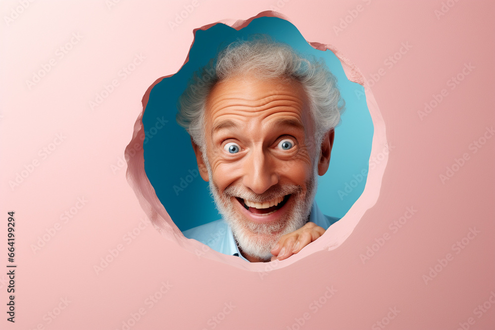 A senior man smiles against a pastel background with holes in advertising style A senior man smiles against a pastel background with holes in advertising style