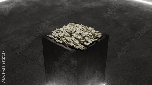 Pile of money on a black block under spotlight photo