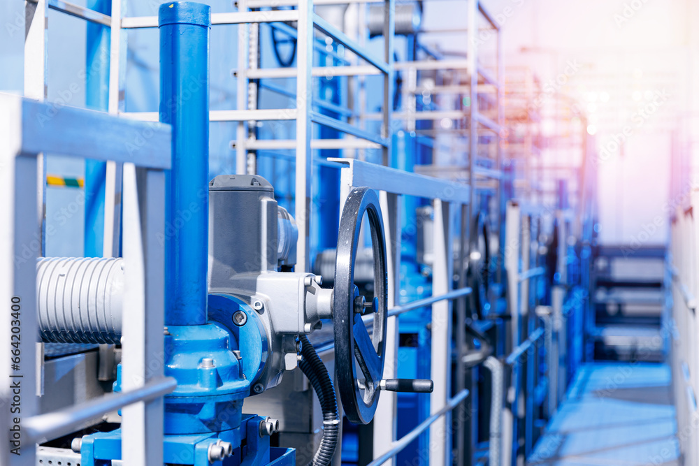 Closeup new blue taps with valve for drinking water pipeline, banner industry waterworks Closeup new blue taps with valve for drinking water pipeline, banner industry waterworks