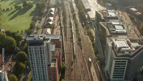 Aerial shot following a train leaving Reading town photo