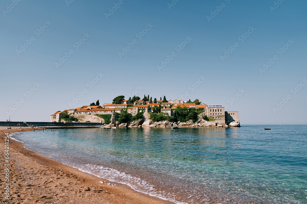 Island of Sveti Stefan in the Bay of Kotor against the blue sky. Montenegro