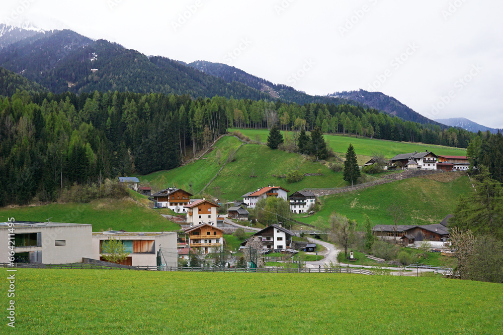 Landscape of Santa Maddalena and exterior village buildings at Val di Funes, land of the pale mountains and beautiful valley in the Dolomites also one of UNESCO World Heritage site- South Tyrol, Italy