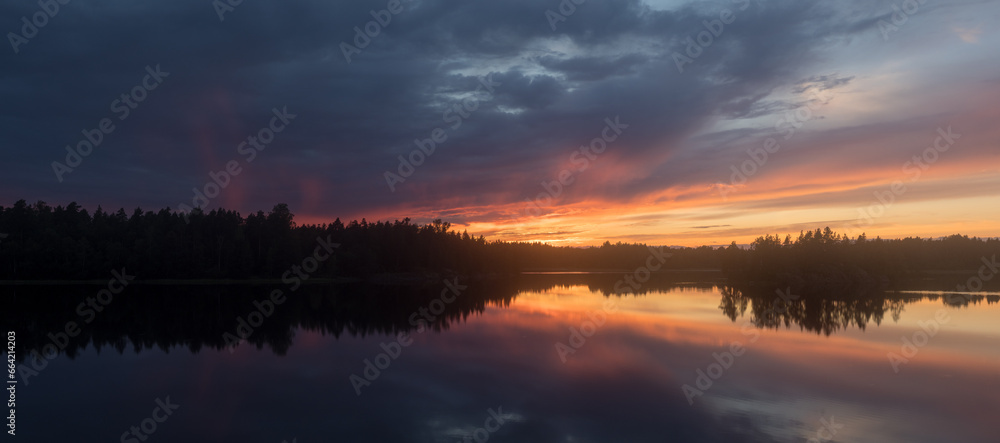 panorama of a cloudy dramatic sunset panorama of a cloudy dramatic sunset