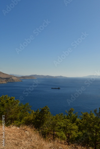 fright cargo ship on horizon from geek island kalymnos © Andreas