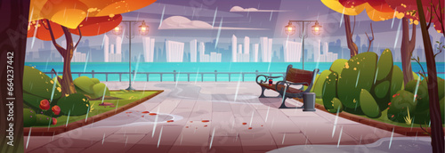 Rain on autumn city promenade with bench in riverside park. Vector cartoon illustration of gloomy public garden with yellow foliage on trees, puddles on road, modern cityscape on horizon, cloudy sky