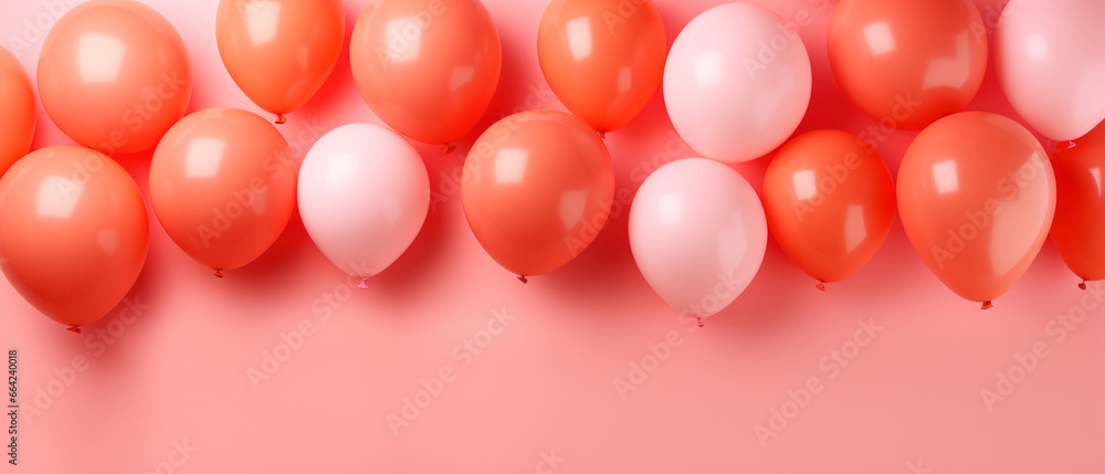 Set of colorful festive matte balloons on coral background