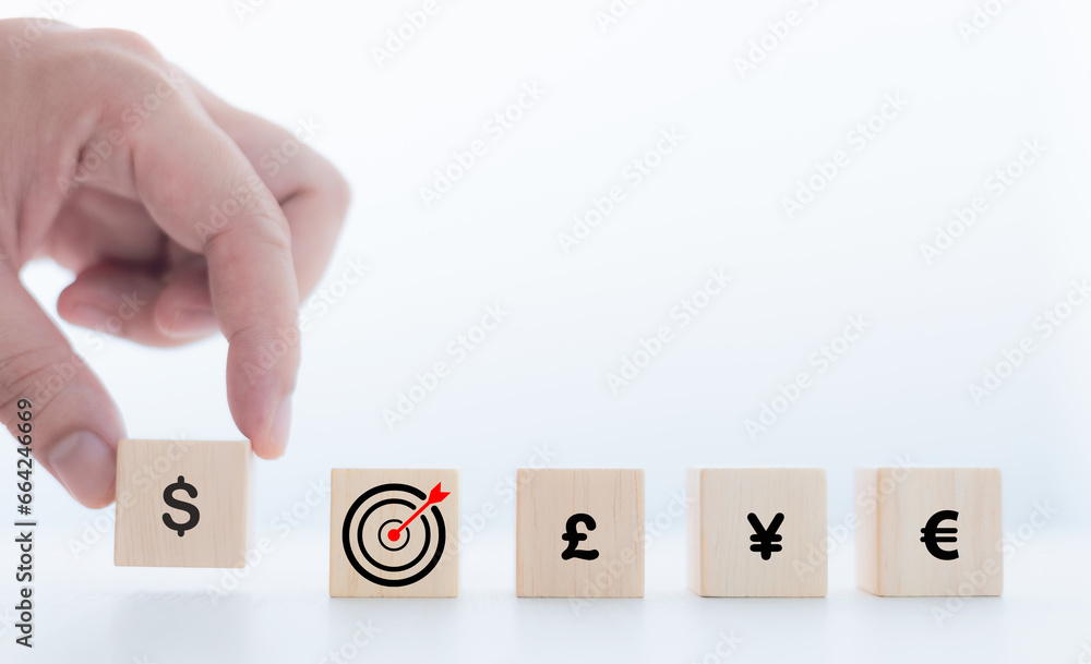 Photo mix of graphics, wooden blocks and icons, goals and money, financial goals concept, investment Photo mix of graphics, wooden blocks and icons, goals and money, financial goals concept, investment