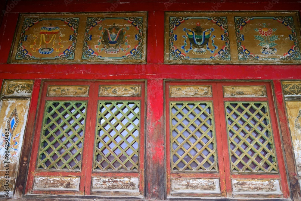 Historical facade of a traditional building in Mongolia, adorned with ornate details and textures