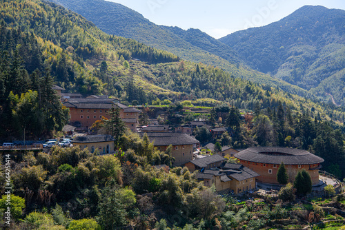 Two hundred years old Tulou in Fujian, China surrounded by the mountains