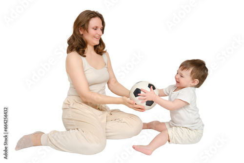 Happy baby with mother play with fotball ball on studio, isolated on white background. Kid about two years old (one year nine months) photo