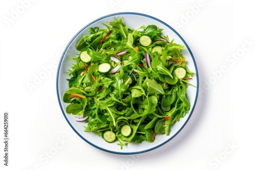 Healthy fresh green salad plate shot from above on white background.