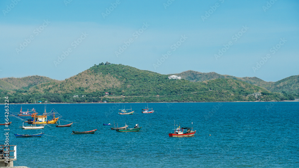 Speedboat, Fishing boat, passenger boat, clear sky and clouds mountain. Passenger boat in the sea. Fisherman wood boat and clean sea in Thailand with travel landscape