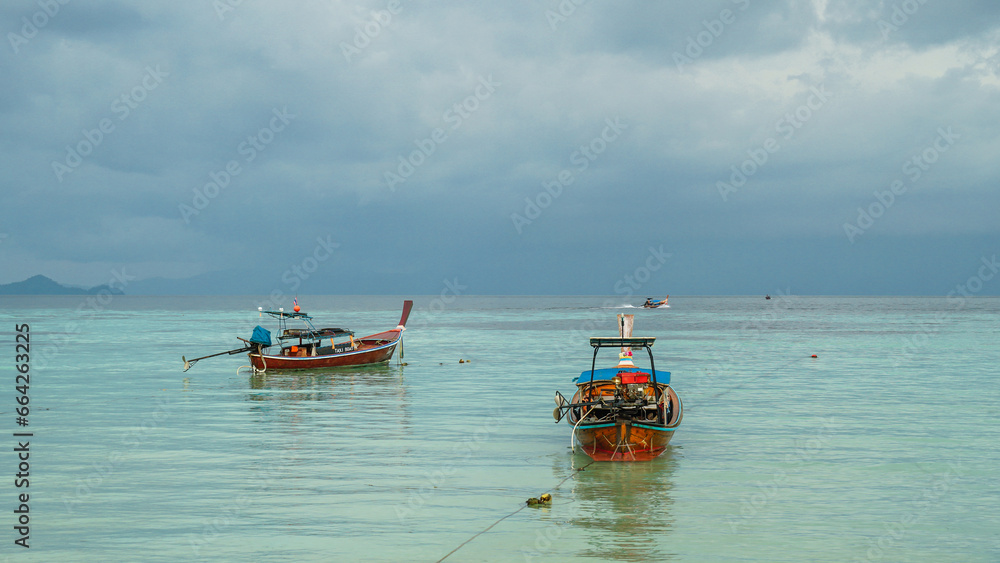 Speedboat, Fishing boat, passenger boat, clear sky and clouds mountain. Passenger boat in the sea. Fisherman wood boat and clean sea in Thailand with travel landscape