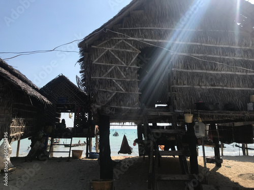 Traditional long-tail boats and houses of Morkan tribe Village or Sea Gypsies and tropical waters of Surin Islands, Fisherman village landscape of Ko Surin Marine National Park.