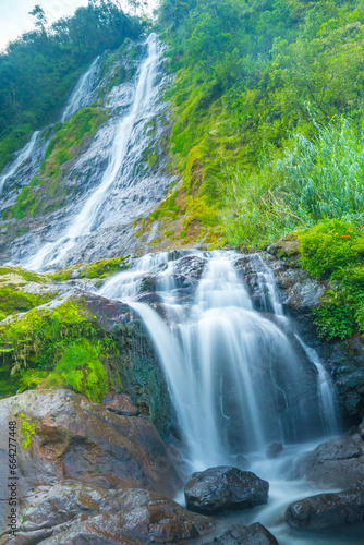 The photo of the Air Terjun Sikarim waterfall in Dieng, Indonesia.
